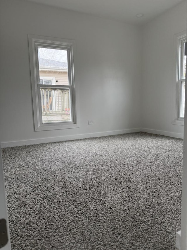 407 Clay St, Ottawa, IL 61350 - empty room with baseboards, plenty of natural light, and carpet floors