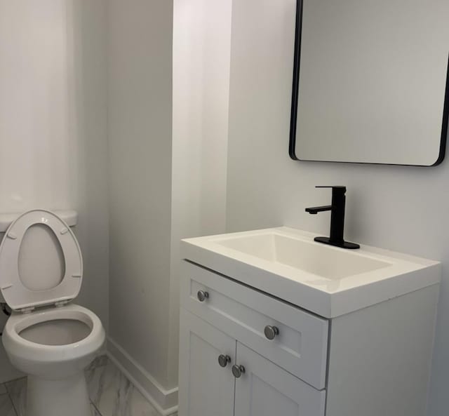 407 Clay St, Ottawa, IL 61350 - bathroom featuring baseboards, toilet, marble finish floor, and vanity