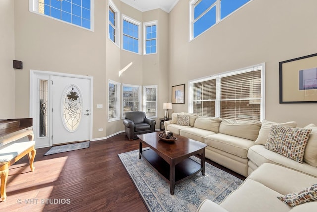 living room featuring wood finished floors and baseboards