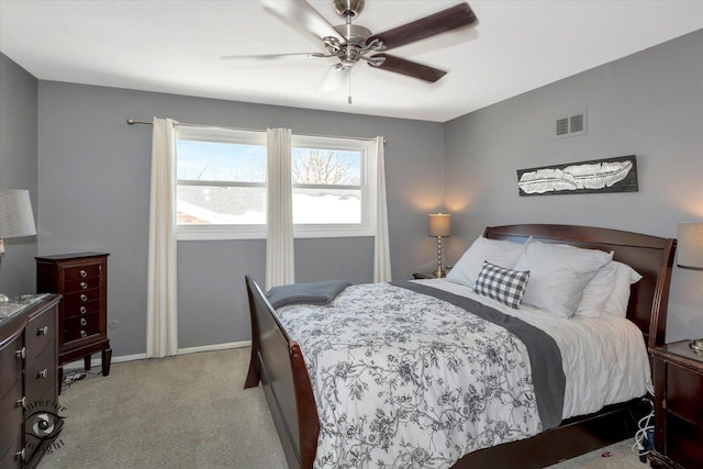 bedroom with visible vents, baseboards, and a ceiling fan