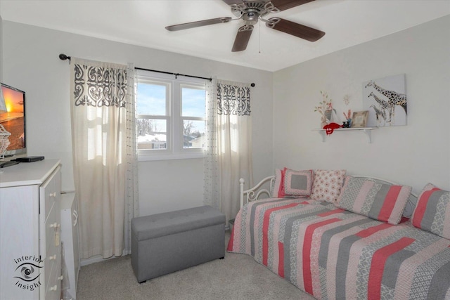 bedroom with a ceiling fan and light colored carpet