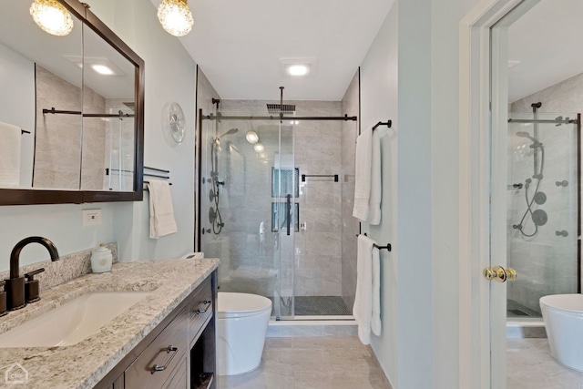 bathroom with visible vents, a stall shower, toilet, and vanity