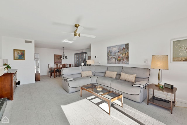 living room featuring visible vents and a ceiling fan