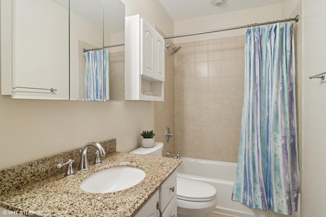 full bathroom featuring toilet, shower / bath combo, and vanity