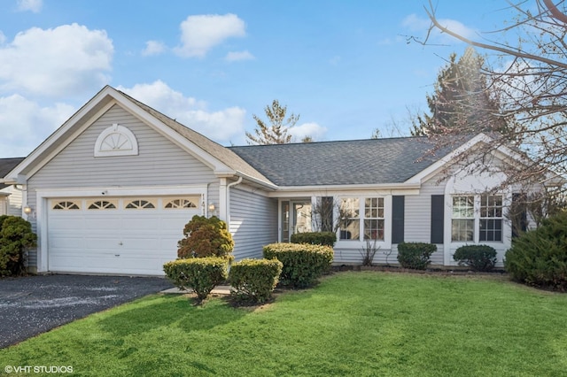 ranch-style home featuring aphalt driveway, a front yard, a garage, and roof with shingles