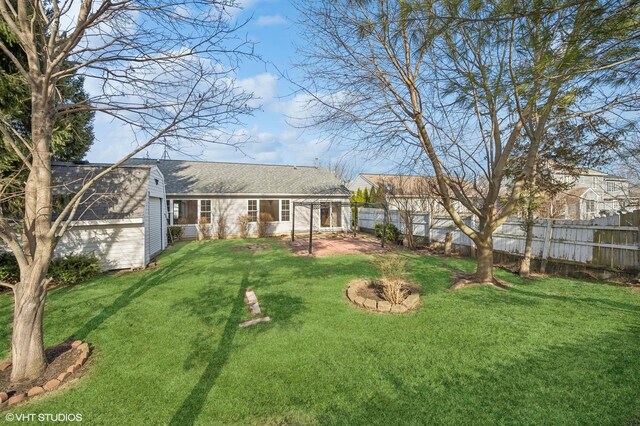 view of yard featuring a garage and fence