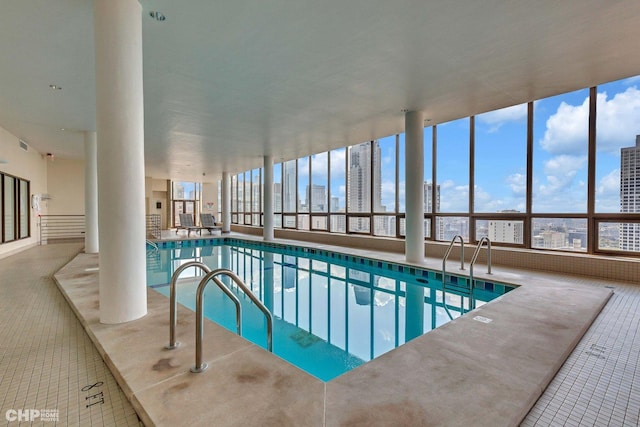 pool featuring a city view and a patio area