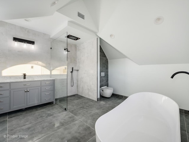 full bathroom with vanity, visible vents, a soaking tub, vaulted ceiling, and a walk in shower