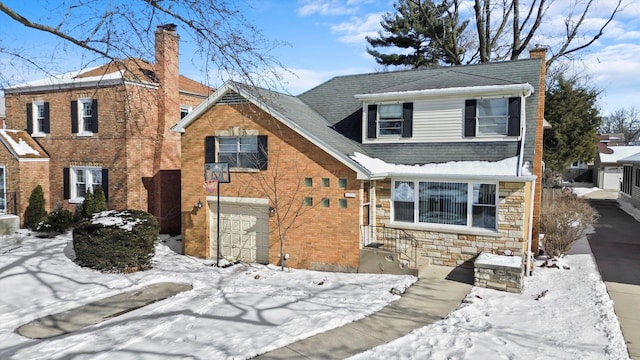 view of front of house featuring a garage, stone siding, brick siding, and a chimney