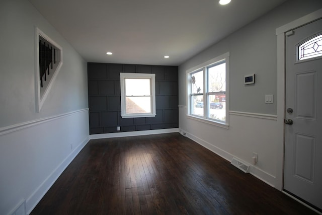 entryway with recessed lighting, visible vents, baseboards, and dark wood-type flooring