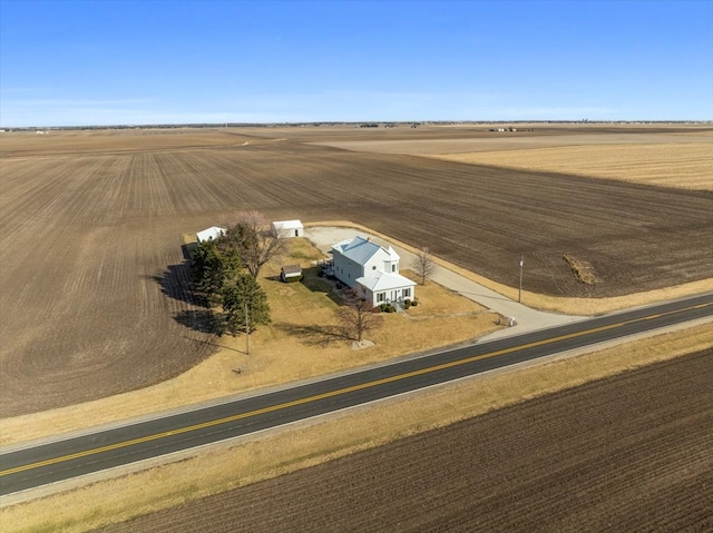 birds eye view of property featuring a rural view