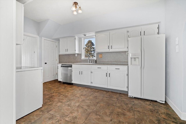 kitchen with white cabinetry, a sink, white refrigerator with ice dispenser, dishwasher, and backsplash