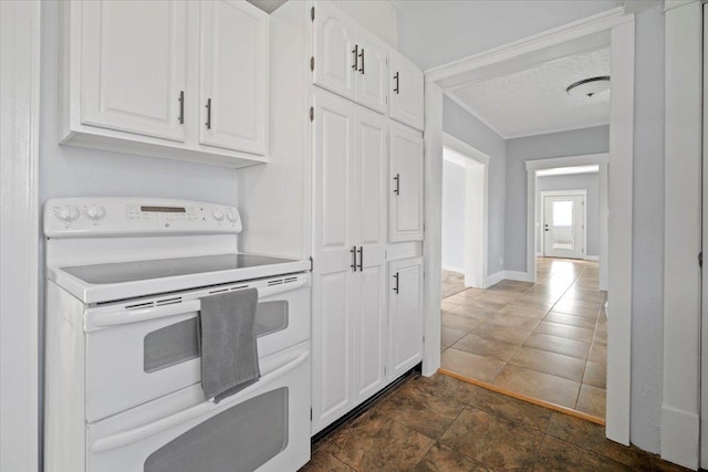 kitchen featuring double oven range, baseboards, white cabinets, and light countertops