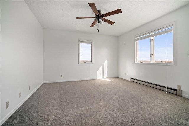 carpeted spare room featuring a textured ceiling, a ceiling fan, baseboards, and a baseboard radiator