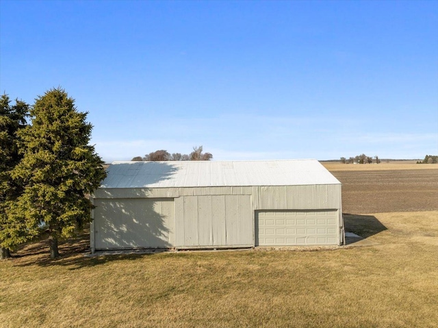 view of pole building with a yard