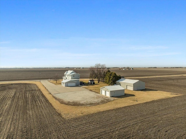 birds eye view of property with a rural view