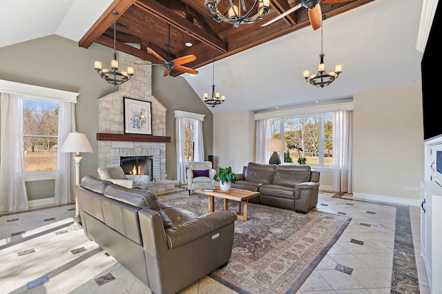 living area with beam ceiling, high vaulted ceiling, ceiling fan with notable chandelier, a fireplace, and baseboards