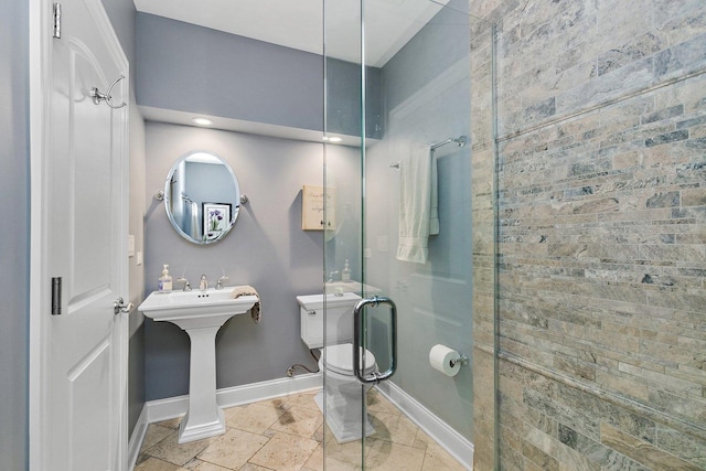 full bath with baseboards, toilet, and stone tile flooring