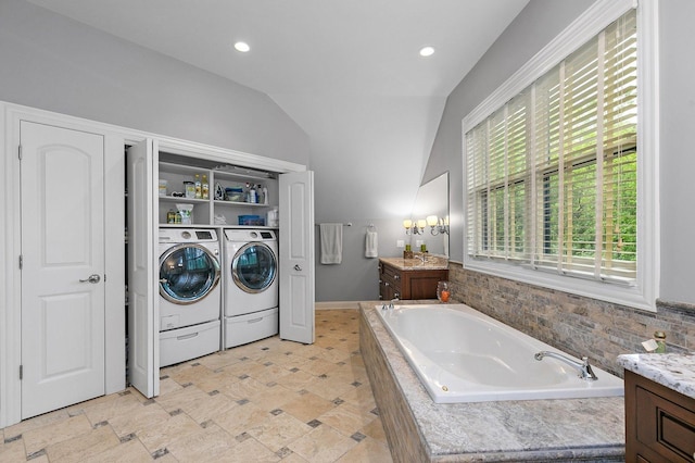 washroom featuring washer and dryer, recessed lighting, and laundry area