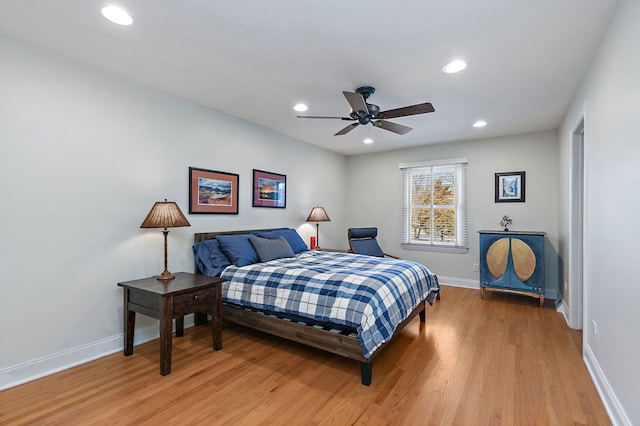 bedroom featuring recessed lighting, light wood-style flooring, baseboards, and ceiling fan