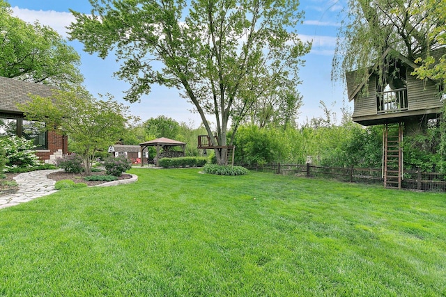 view of yard featuring a gazebo and fence