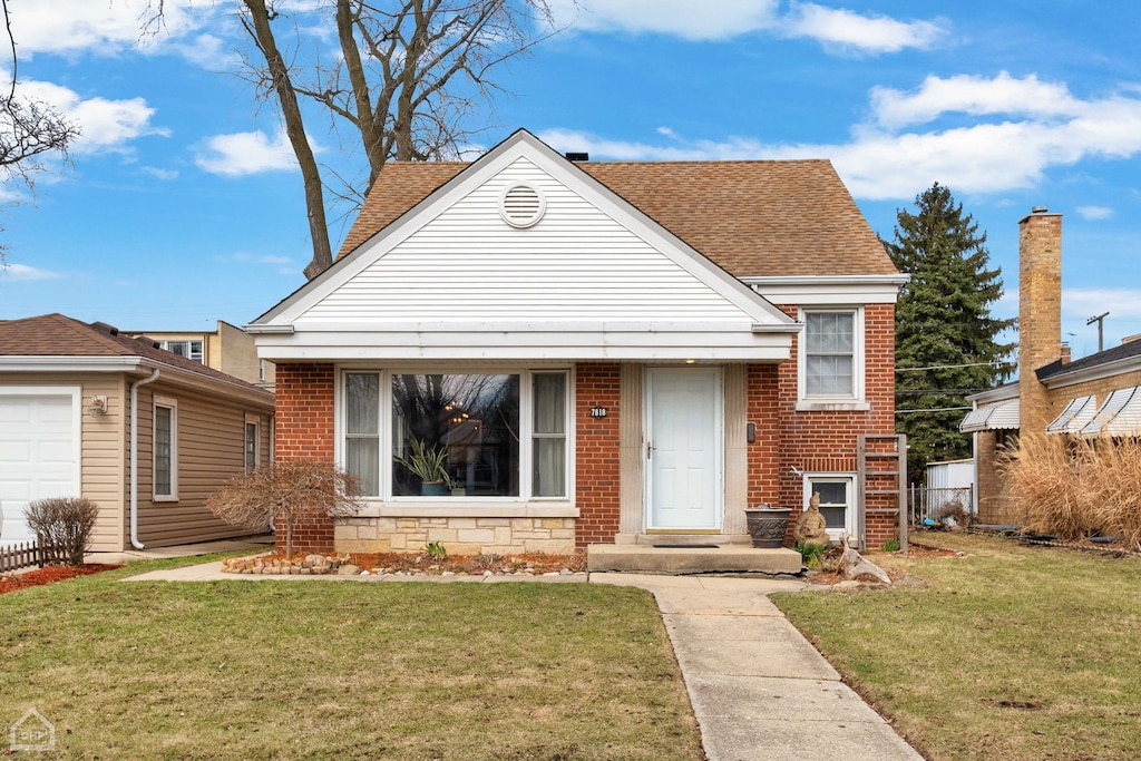7818 Babb Ave, Skokie, IL 60077 - view of front of property featuring stone siding, brick siding, a front yard, and a shingled roof