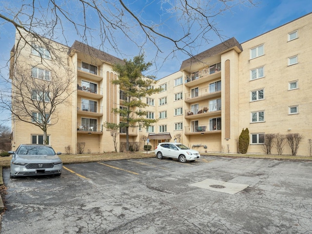 view of property with uncovered parking