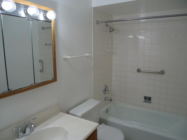 bathroom featuring tub / shower combination, toilet, and vanity