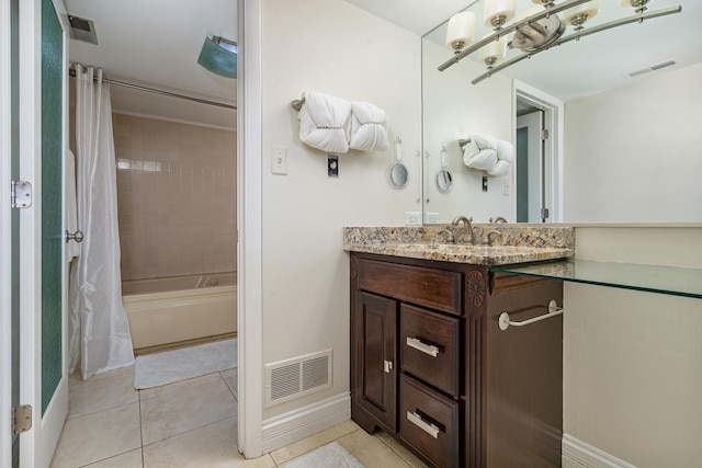 full bathroom with visible vents, vanity, and tile patterned flooring