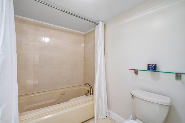 bathroom featuring tile patterned flooring, toilet, shower / tub combo, and baseboards