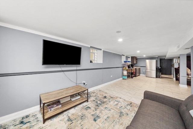 living area with light tile patterned flooring, recessed lighting, and baseboards