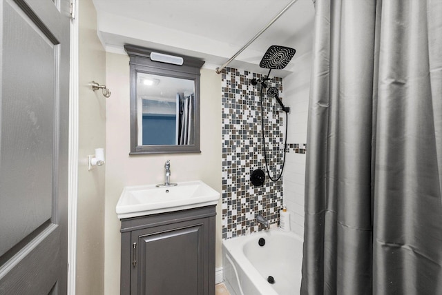 bathroom with shower / tub combo with curtain and vanity