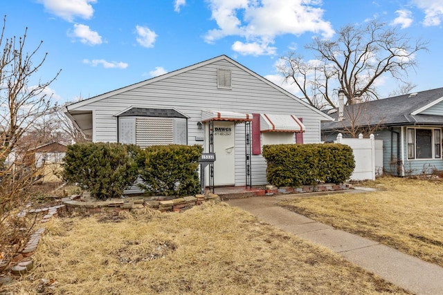 bungalow with a front yard