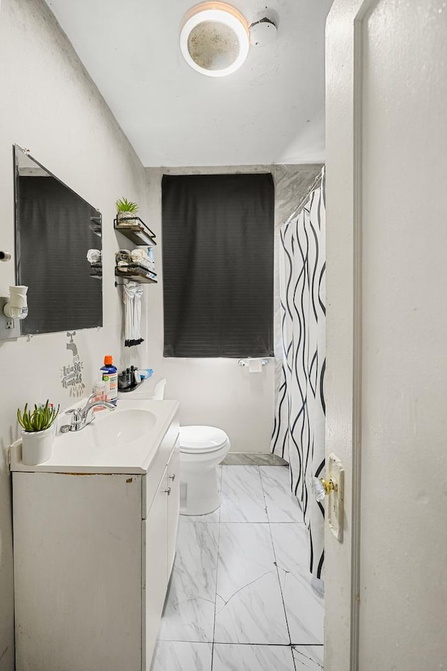 bathroom featuring vanity, a shower with shower curtain, toilet, and marble finish floor