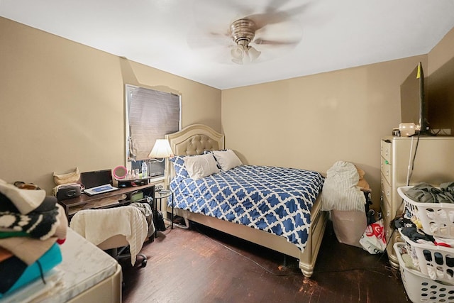 bedroom with ceiling fan and wood finished floors