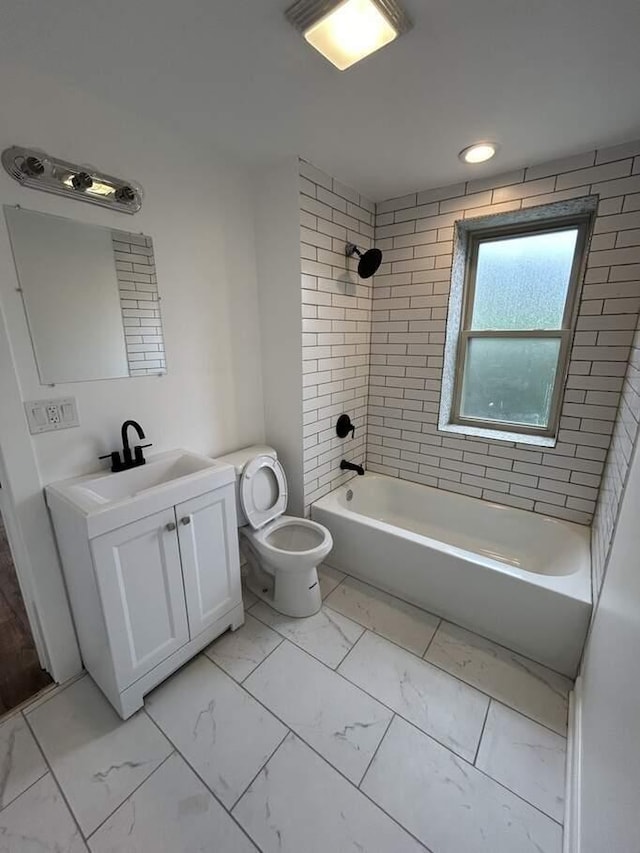 bathroom featuring shower / bathtub combination, toilet, marble finish floor, and vanity