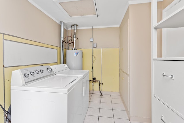 laundry room with light tile patterned floors, washer and clothes dryer, laundry area, and water heater