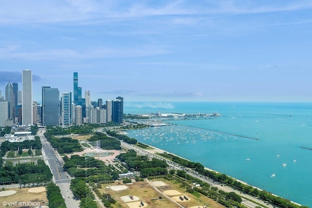 bird's eye view featuring a water view and a city view