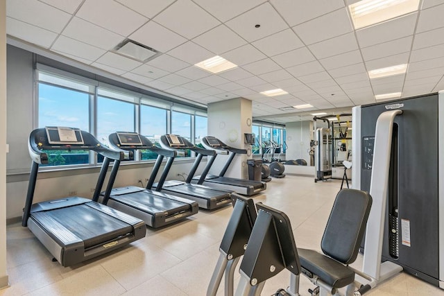 workout area featuring visible vents and a drop ceiling