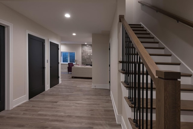511 N Branch Rd, Glenview, IL 60025 - hall with recessed lighting, baseboards, wood finished floors, and stairway