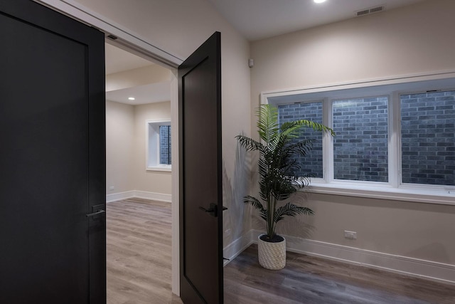 511 N Branch Rd, Glenview, IL 60025 - corridor with baseboards, recessed lighting, wood finished floors, and visible vents