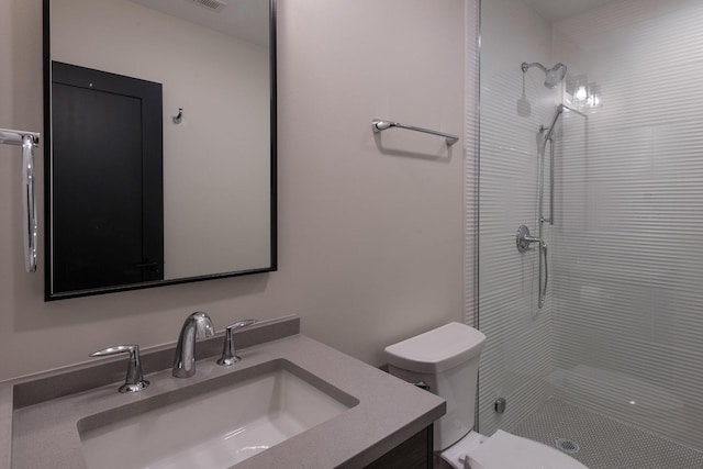 511 N Branch Rd, Glenview, IL 60025 - bathroom with vanity, a tile shower, and toilet