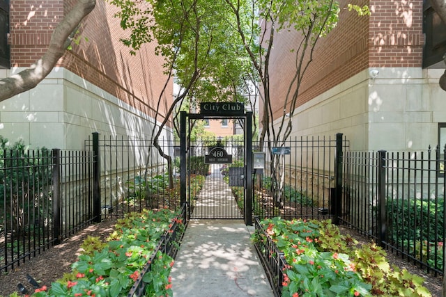 view of gate with fence