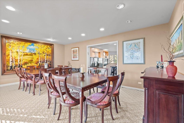 dining area with light colored carpet, recessed lighting, and baseboards