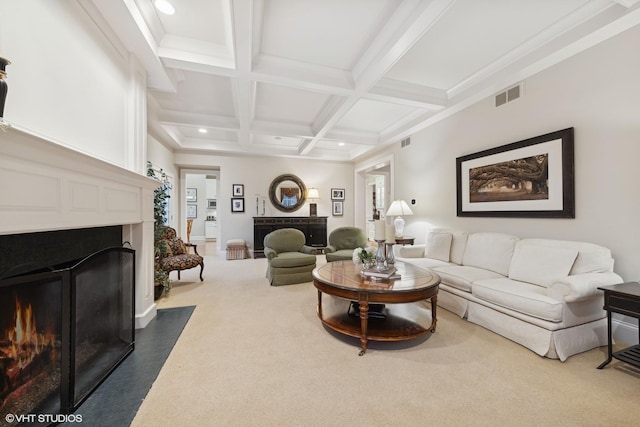 living area featuring visible vents, carpet, a fireplace with flush hearth, beam ceiling, and coffered ceiling