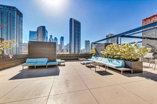 view of patio featuring a view of city and an outdoor hangout area