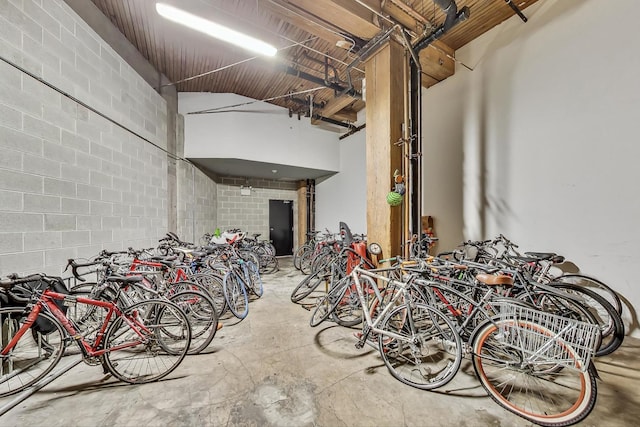 garage featuring bike storage and concrete block wall