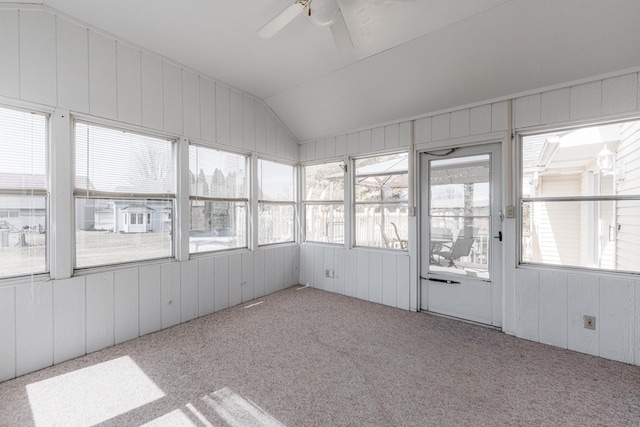 unfurnished sunroom featuring lofted ceiling and a ceiling fan