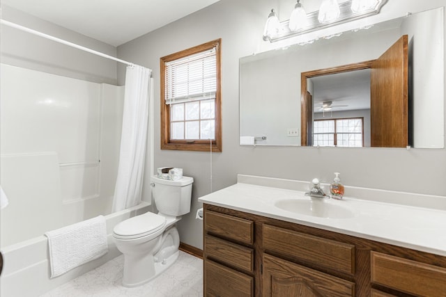 full bathroom featuring vanity, toilet, a ceiling fan, and shower / tub combo with curtain