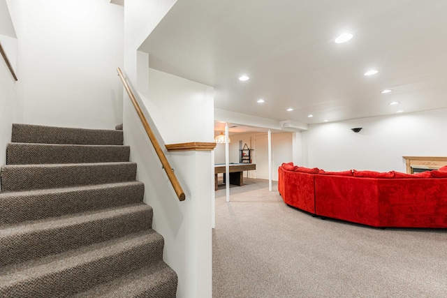 stairs with carpet and recessed lighting